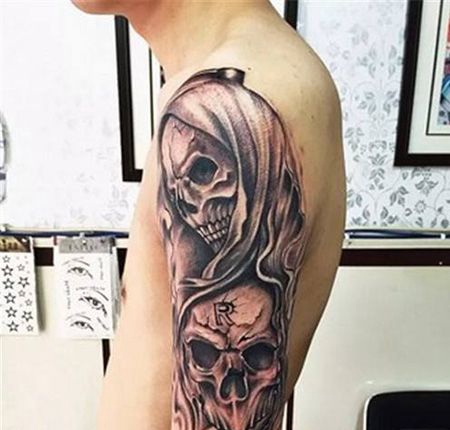 大臂个性的鬼头纹身图片