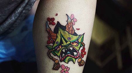 小腿绿色鬼头纹身图案
