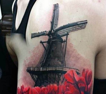 大臂精美的风车纹身图片