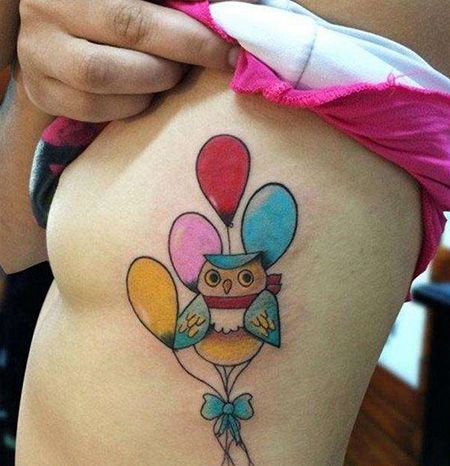 女生胸部猫头鹰和气球纹身图案