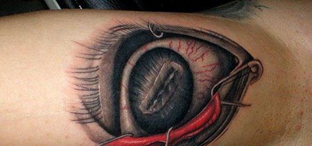 大臂个性的别针眼球纹身图案