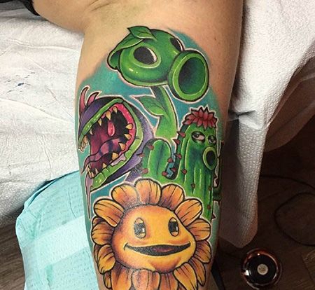 小腿豌豆和向日葵纹身图案