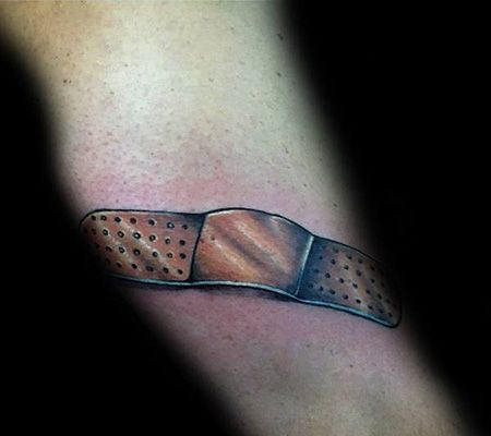 腿部创可贴纹身图片