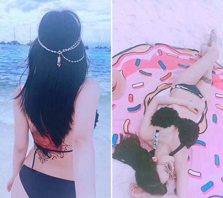 沙滩比基尼美女背部花瓣纹身