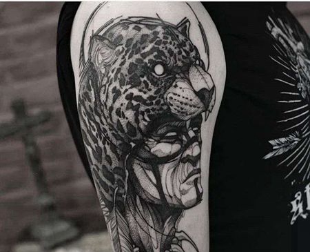 点线小臂豹子人像纹身图案
