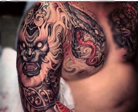 新传统大臂唐狮蛇纹身图案