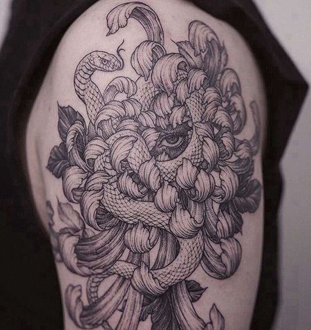 点线大臂蛇眼睛菊花纹身图案