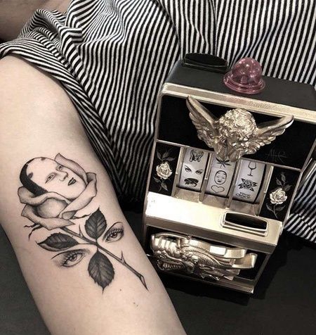 小腿玫瑰眼睛纹身图案