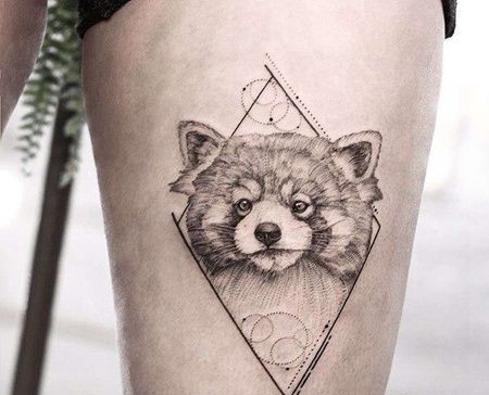 点线大腿浣熊纹身图案