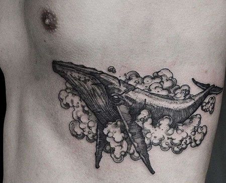点线胸下鲸鱼纹身图案