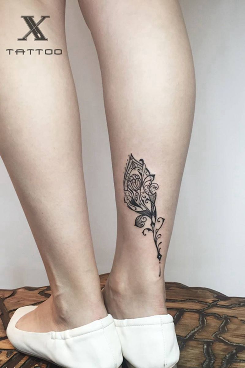 橘子花纹身图片_成品腿部几何字符图腾纹身图案