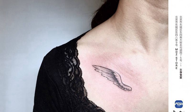 翅膀纹身图片_胸部点刺纹身图案