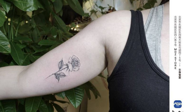 花纹身图片_手臂点刺纹身图案