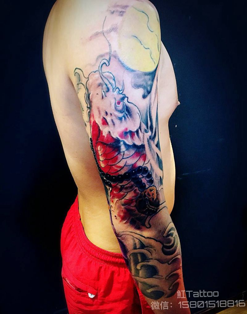 七分袖锦鲤花臂纹身图片_成品手臂传统动物纹身图案