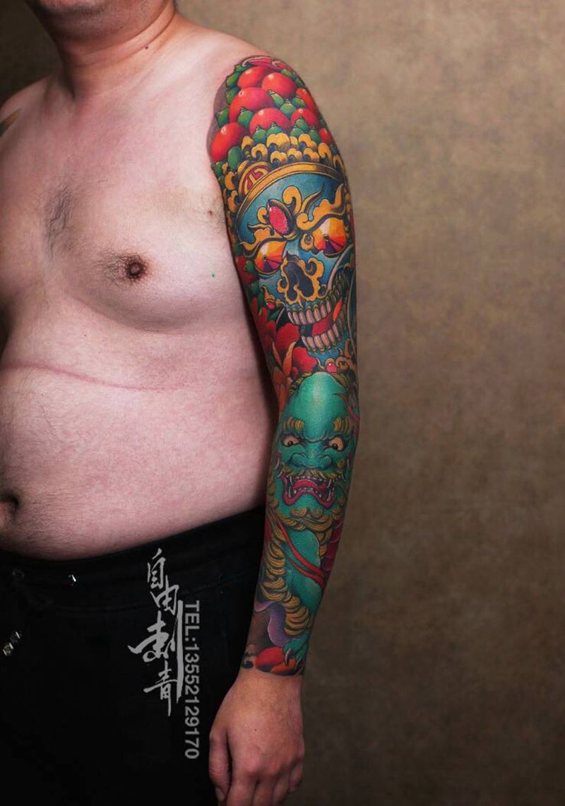 北京自由刺青唐狮子嘎巴拉花臂纹身图片_成品手臂传统宗教动物纹身图案