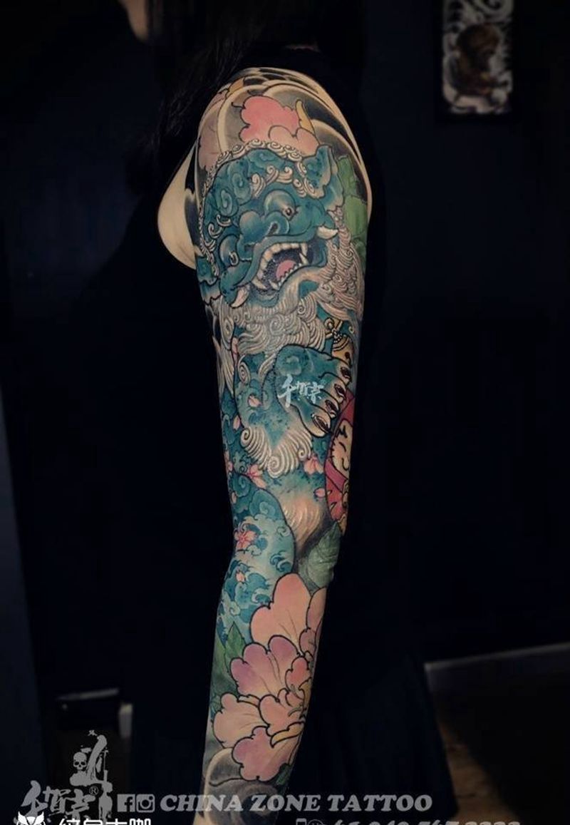 唐狮子整臂纹身图片_传统几何植物宗教原创肩部背部成品手臂写实纹身图案