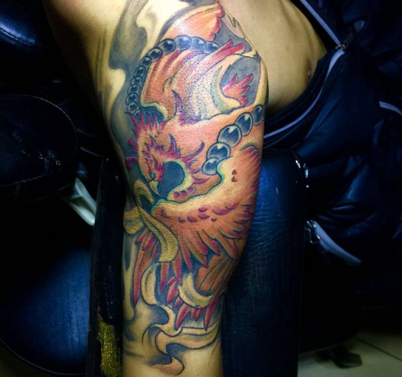 今日作品大臂凤凰纹身图片_成品手臂传统动物纹身图案