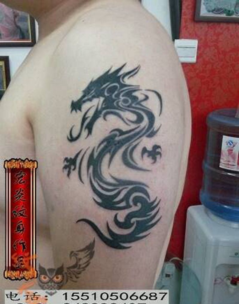 图腾龙纹身图片_手臂传统图腾纹身图案