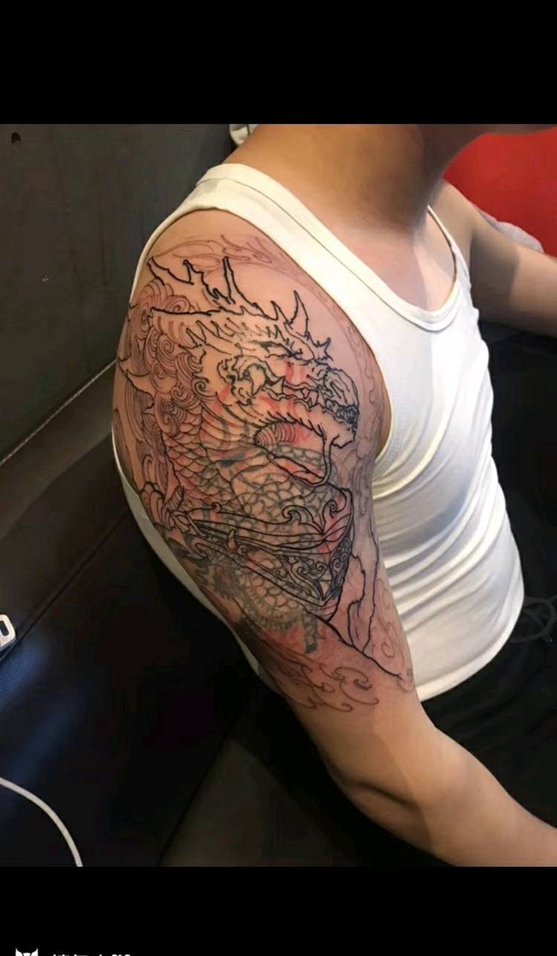 麒麟遮盖纹身图片_肩部手臂传统动物鬼神成品纹身图案