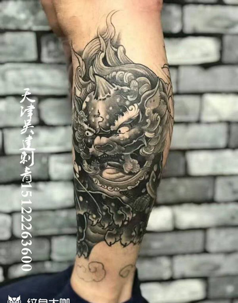 唐狮牡丹纹身图片_腿部新传统纹身图案