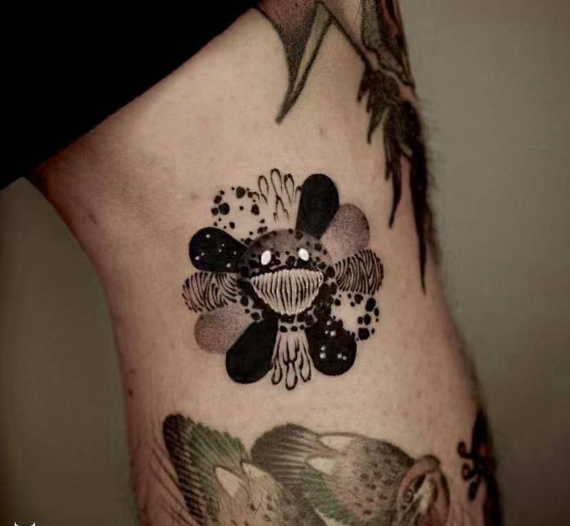 暗黑太阳花纹身图片_腿部纹身图案