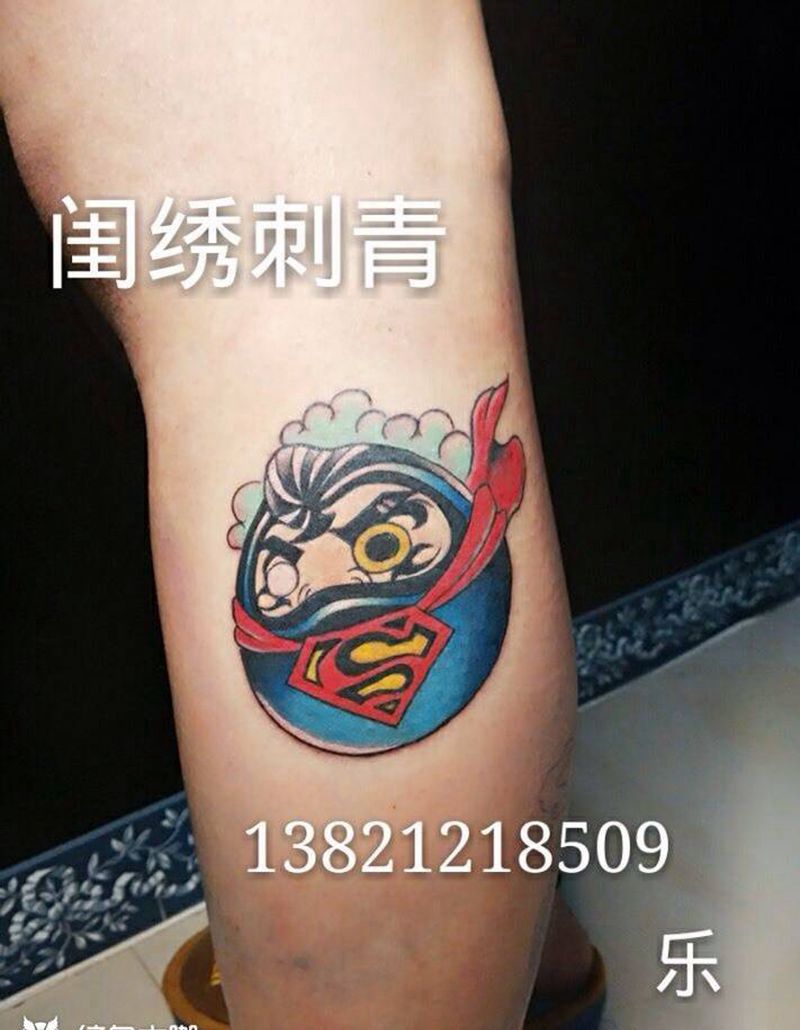 超人达摩蛋纹身图片_成品腿部习俗宗教纹身图案