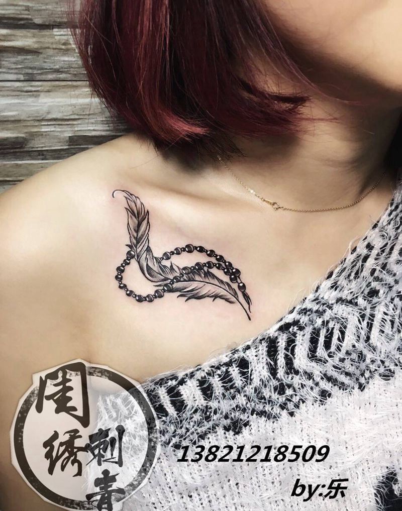 小羽毛纹身图片_成品胸部肩部颈部清新贴纸静物纹身图案