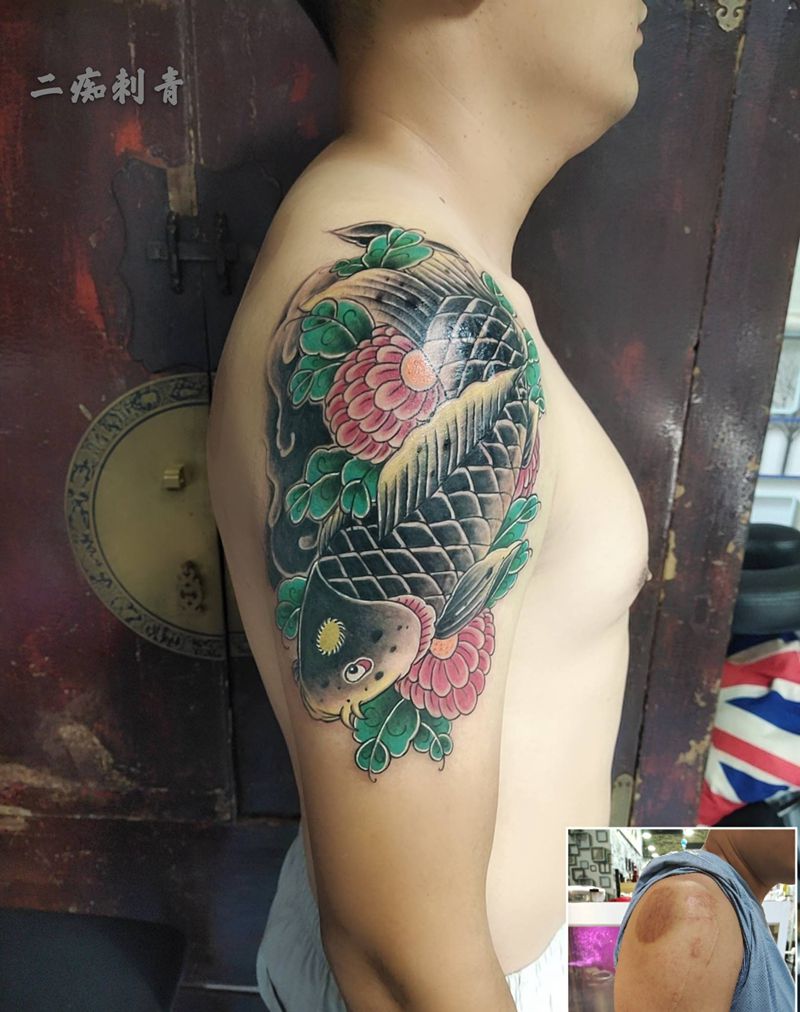 鱼纹身图片_手臂纹身图案