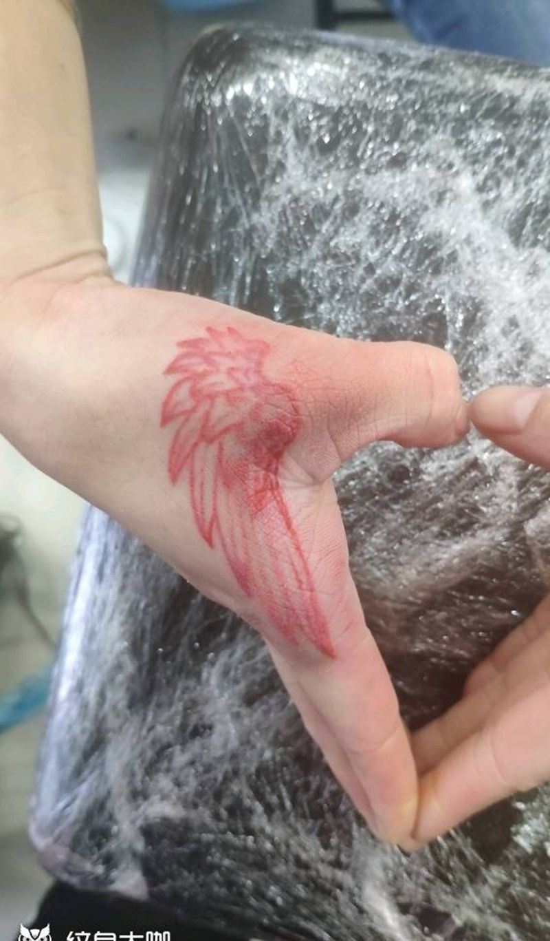 翅膀纹身图片_手部纹身图案