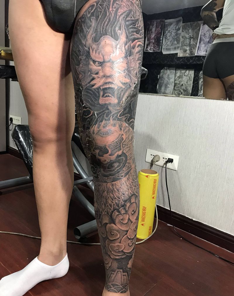 石雕龙纹身图片_腿部新传统纹身图案