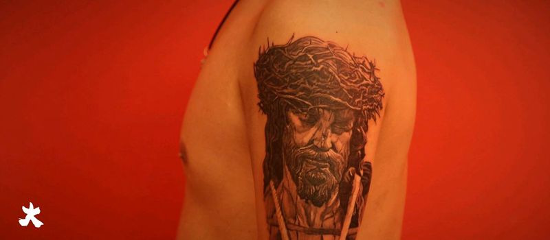 耶稣纹身图片_手臂欧美写实纹身图案