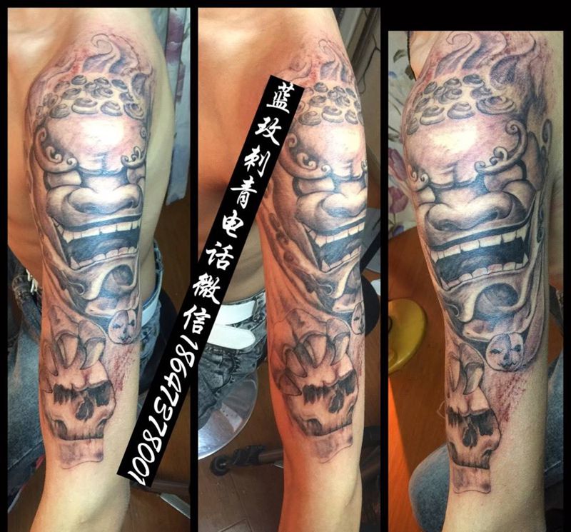 大臂唐狮纹身图片