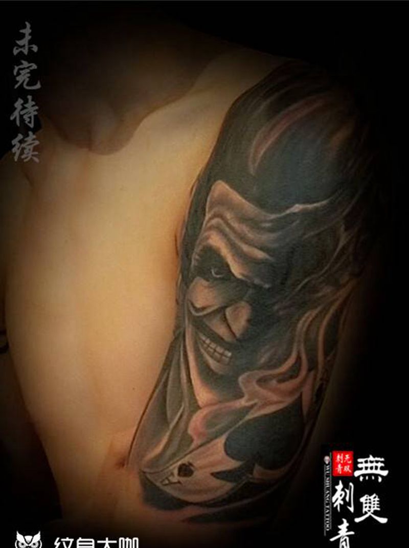 邪恶小丑纹身图片_手臂欧美写实纹身图案