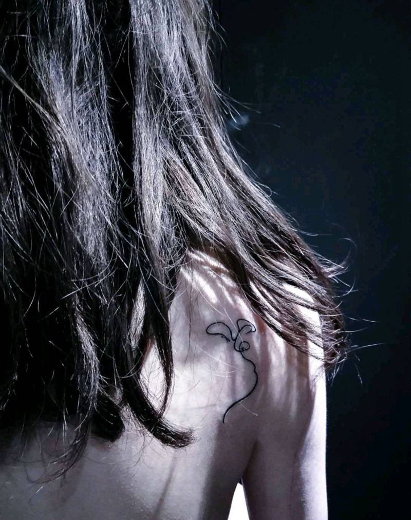 两个人的脸纹身图片_宇刺青纹身图案