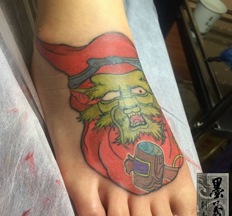 达摩龙蛋纹身图片_成品脚部传统鬼神纹身图案