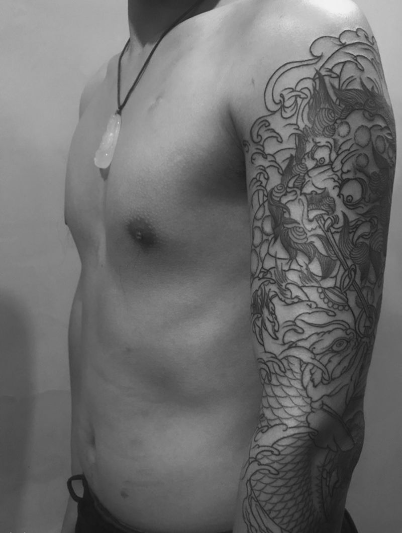 唐狮鱼花臂纹身图片