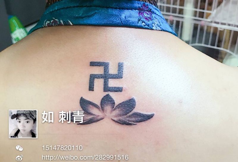 万字佛符号纹身图片