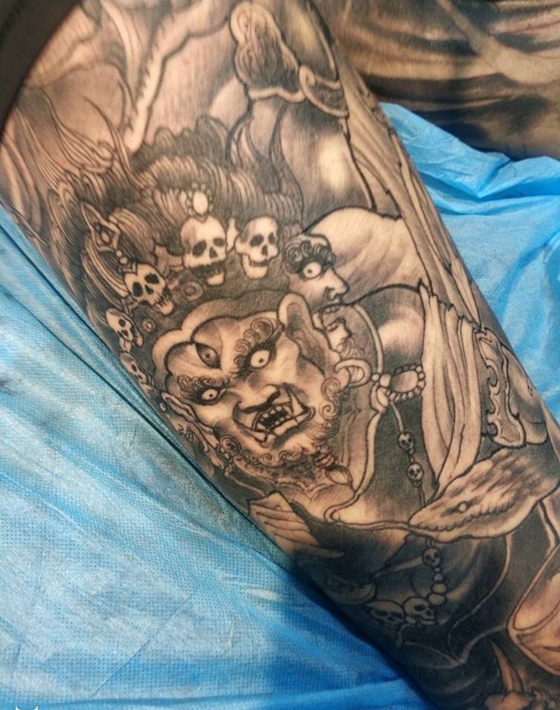 大黑天财神花腿纹身图片_腿部新传统纹身图案