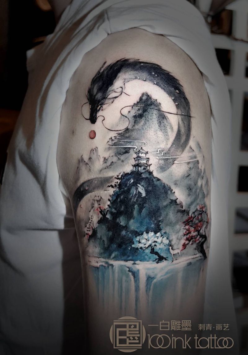 龙升山水间纹身图片_手臂水墨龙纹身图案