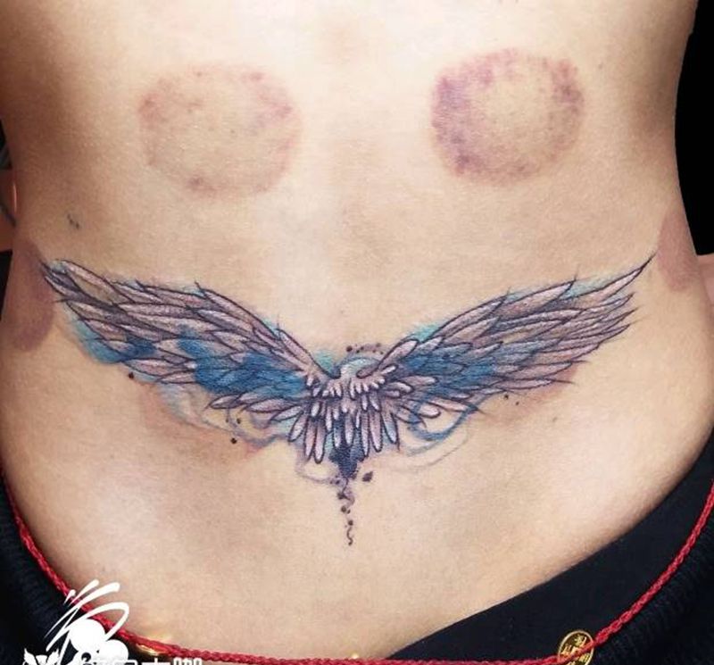 遮盖纹身图片_腰部水墨水彩翅膀羽毛遮盖纹身图案