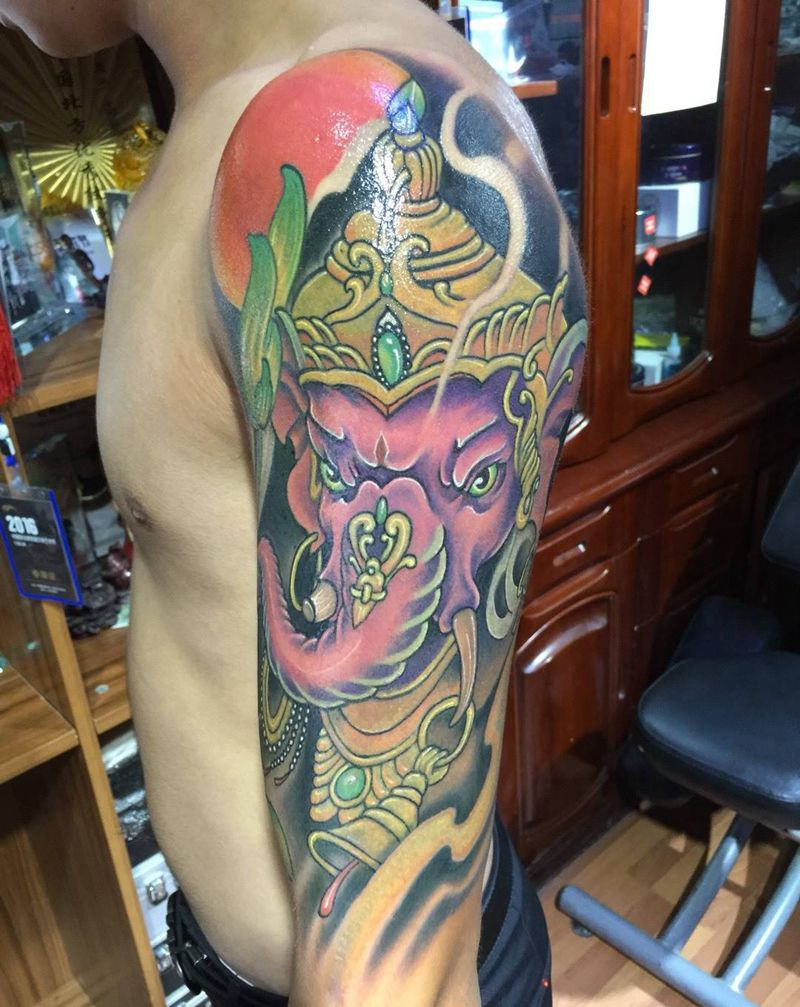 大臂象神 修改遮盖前后对比纹身图片_成品遮盖动物传统手臂纹身图案