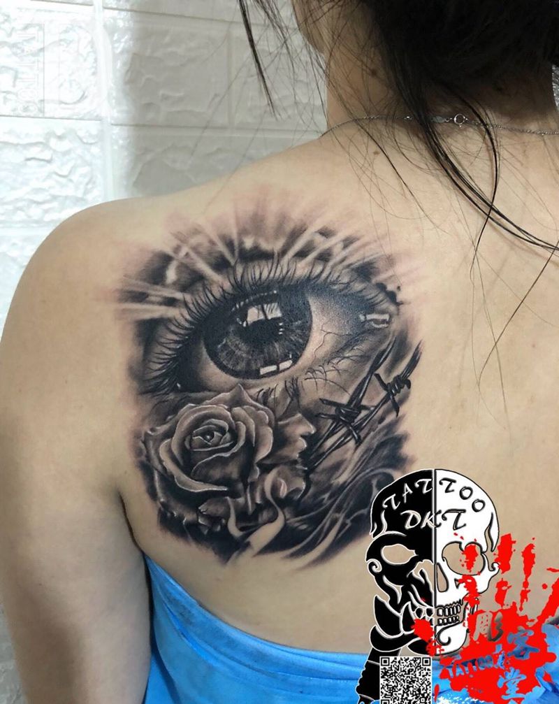 眼睛玫瑰纹身图片_背部欧美写实纹身图案
