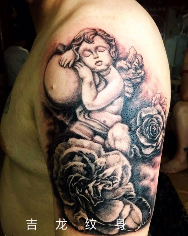 小天使纹身图片_肩部成品写实肖像人物植物纹身图案