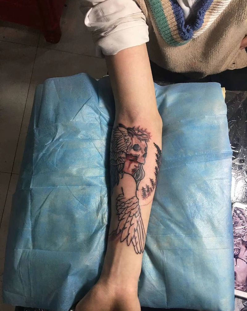 小臂纹身图片_手臂羽毛鸟骷髅纹身图案