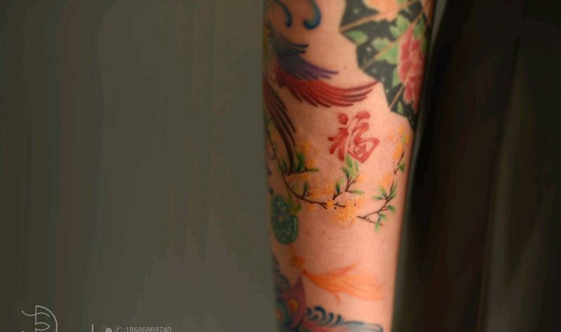 凤纹身图片_手臂彩色清新纹身图案