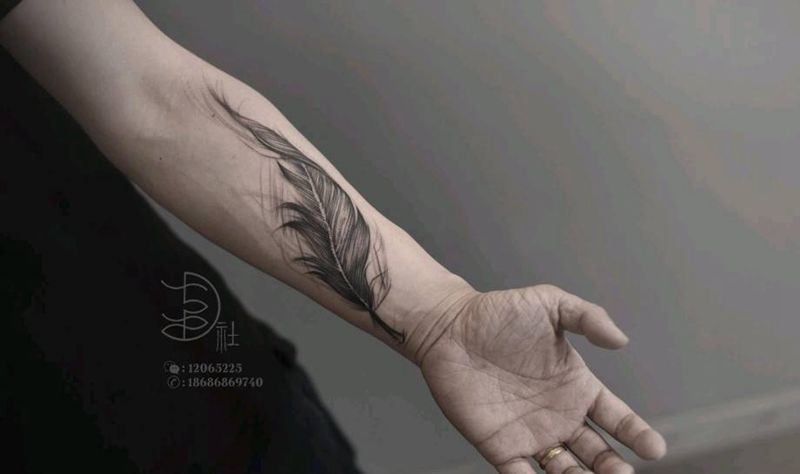 羽毛纹身图片_手臂点刺几何几何羽毛纹身图案