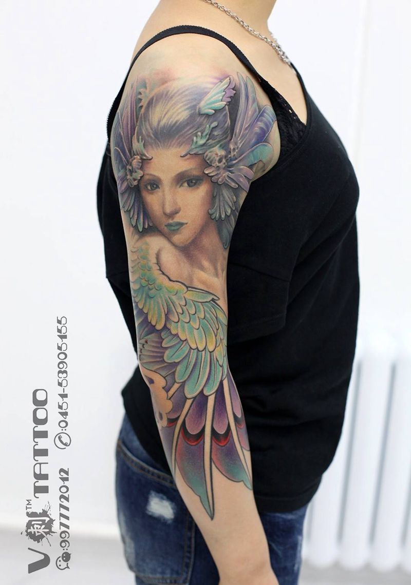 信仰自己是对生命的遵从！纹身图片_成品手臂肖像欧美写实阿V作品花臂哈尔滨V刺翅膀纹身图案