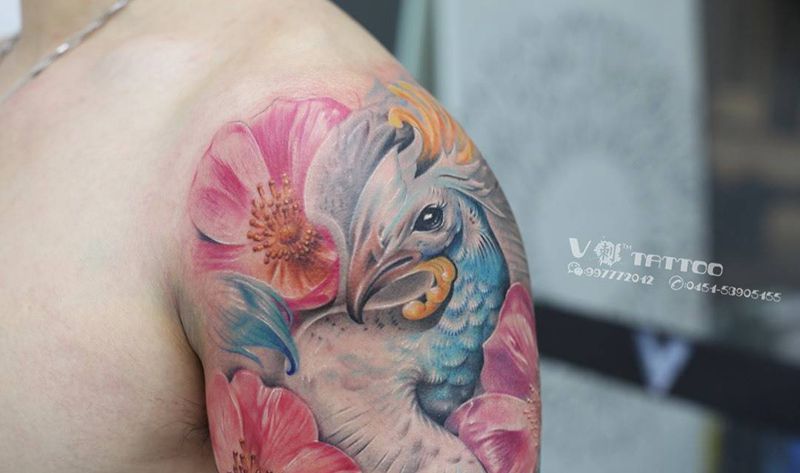 一朵花 不是拿手好戏，我们擅长的 是向你描绘一个春天！纹身图片_成品手臂动物写实阿V作品哈尔滨V刺花孔雀纹身图案