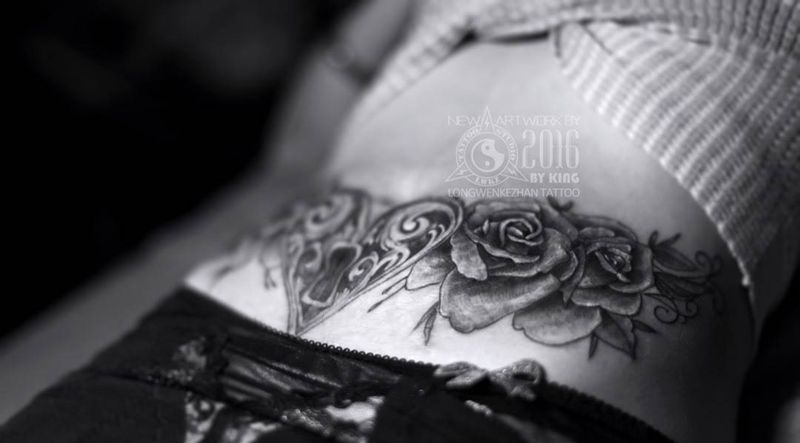 龙纹刻战刺青出品纹身图片_成品腰部植物纹身图案