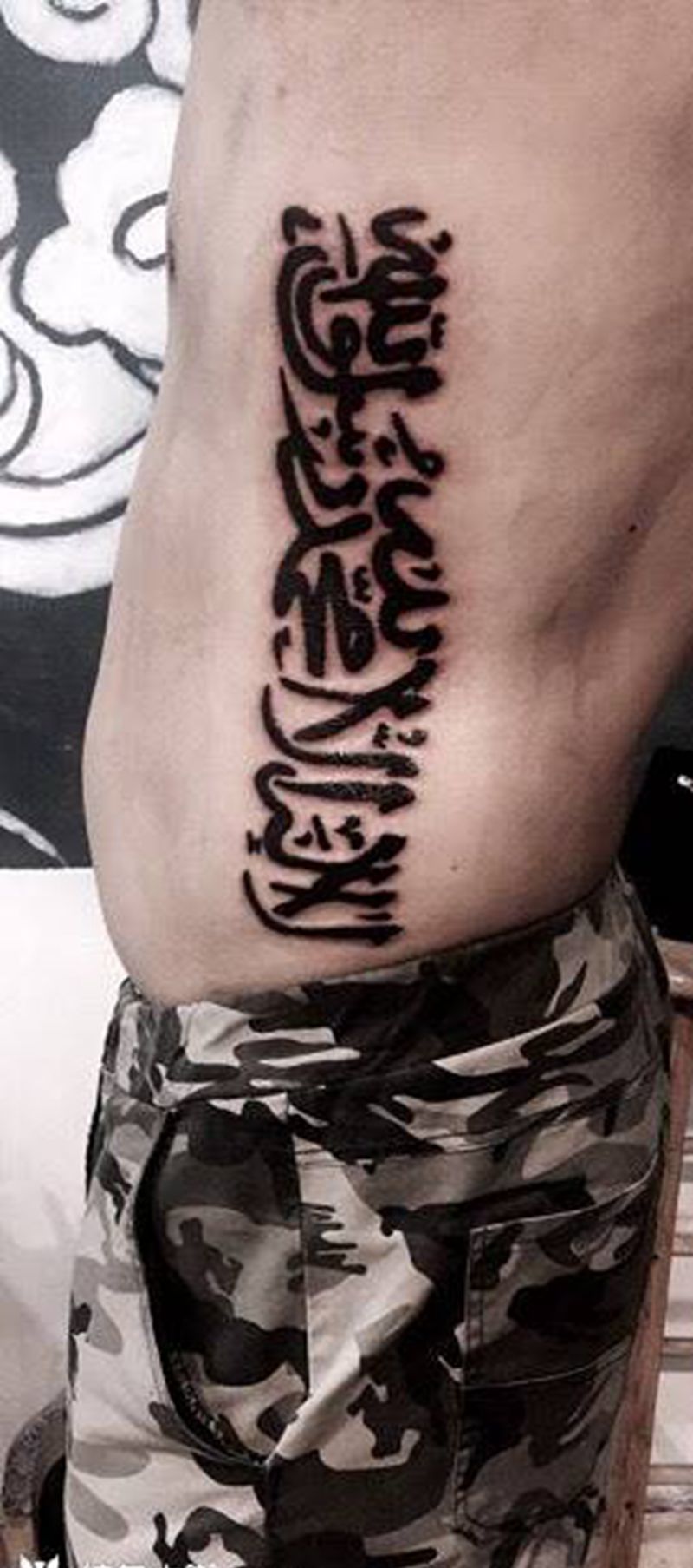信仰纹身图片_成品腹部图腾字符宗教纹身图案